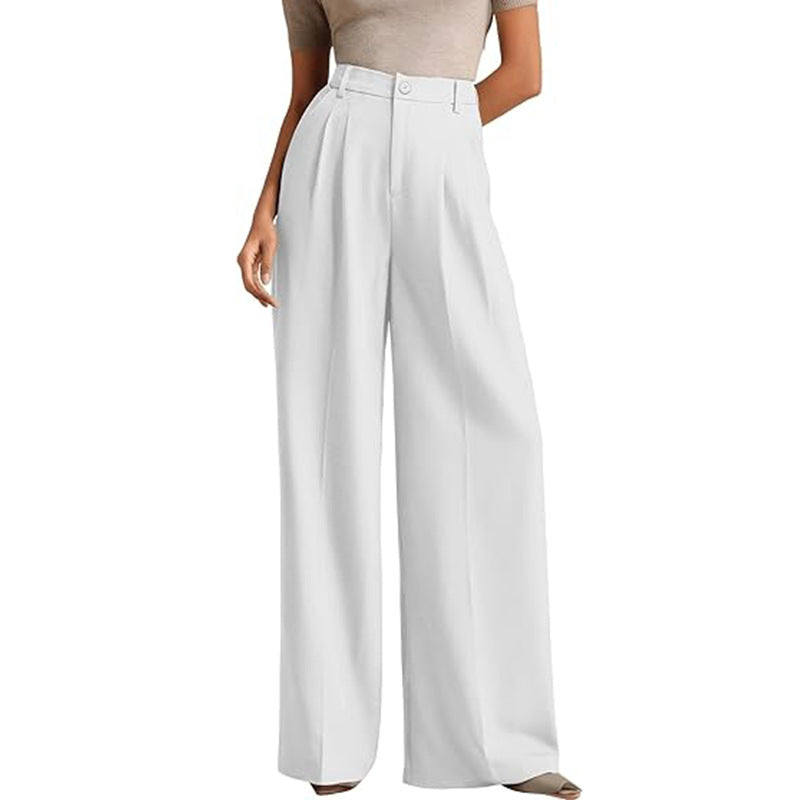 A woman in a high-waisted suit pants