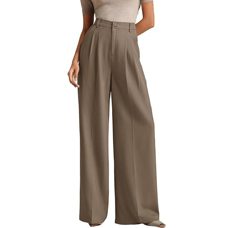 A woman in a high-waisted suit pants