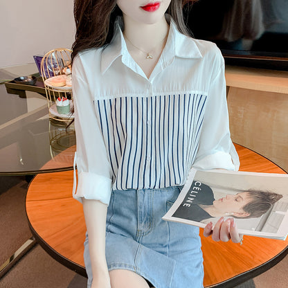 A woman in a long-sleeved top and a striped patchwork shirt