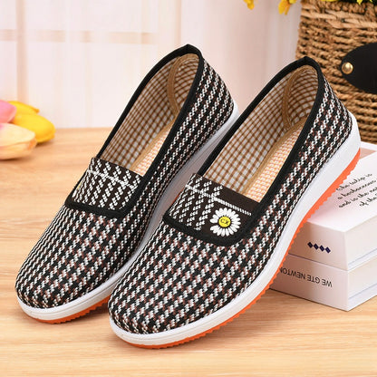 A woman wearing canvas shoes