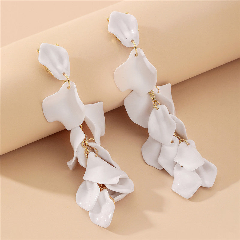 A woman with a high-end, trendy and eco-friendly earring style
