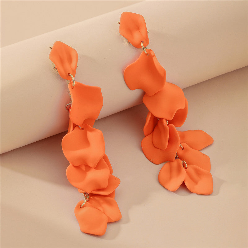 A woman with a high-end, trendy and eco-friendly earring style