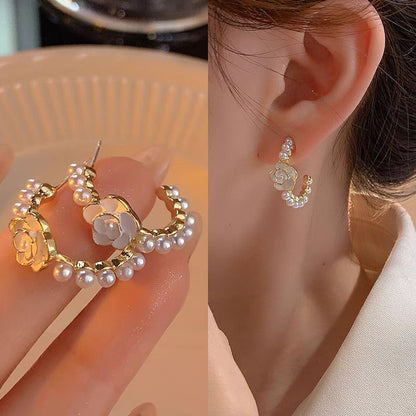 A woman with plain hoop earrings