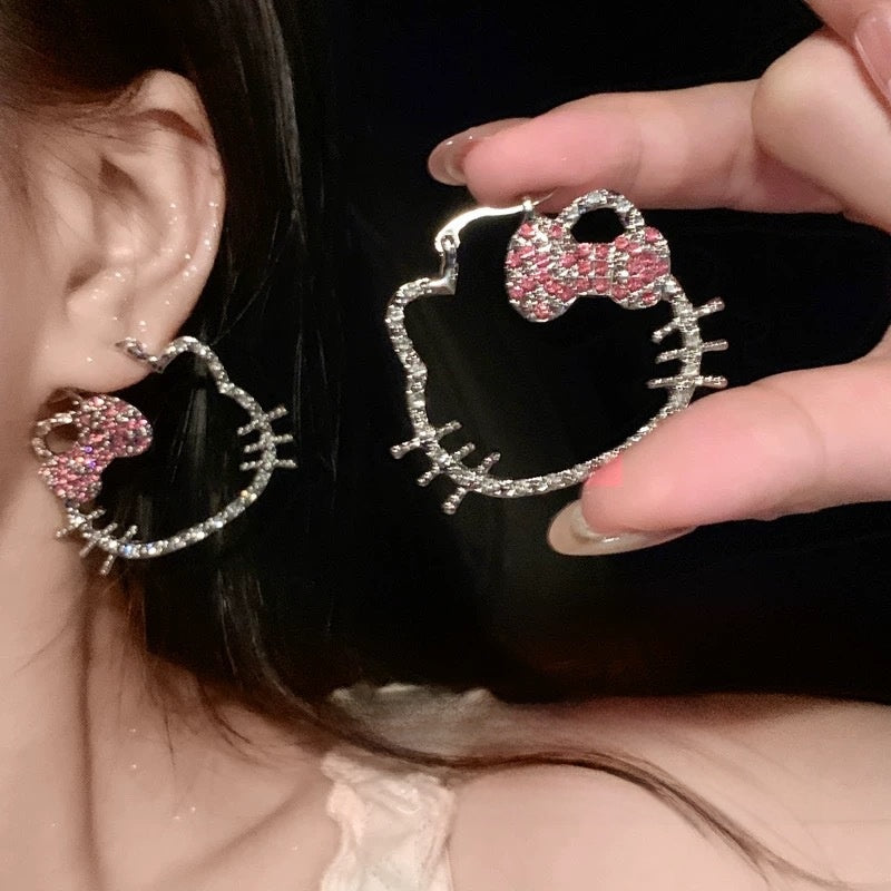 A woman with plain hoop earrings