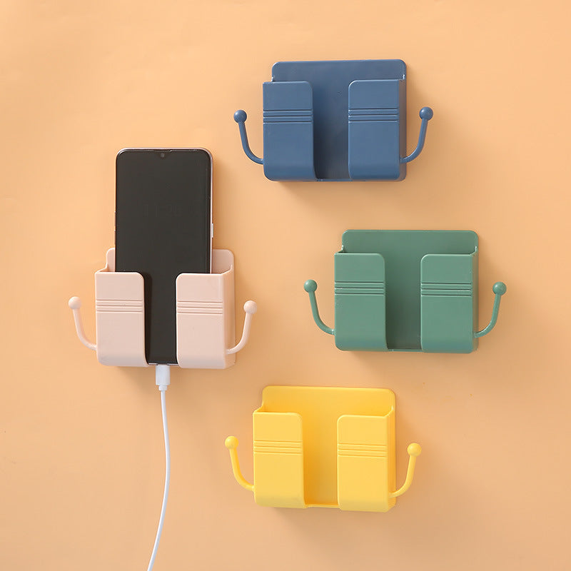Adhesive phone charging stand