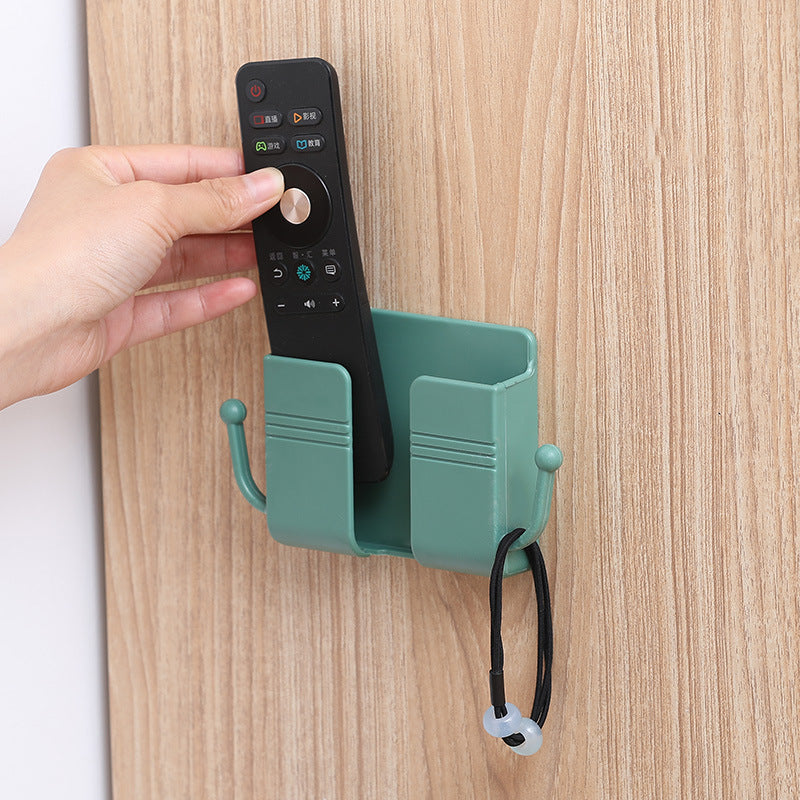Adhesive phone charging stand