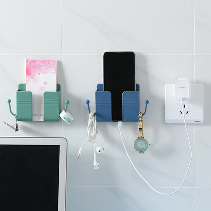 Adhesive phone charging stand