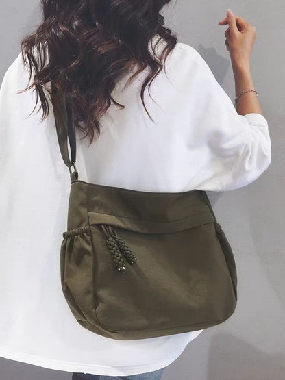 Adjustable Canvas Shoulder Bag with Multiple Pockets
