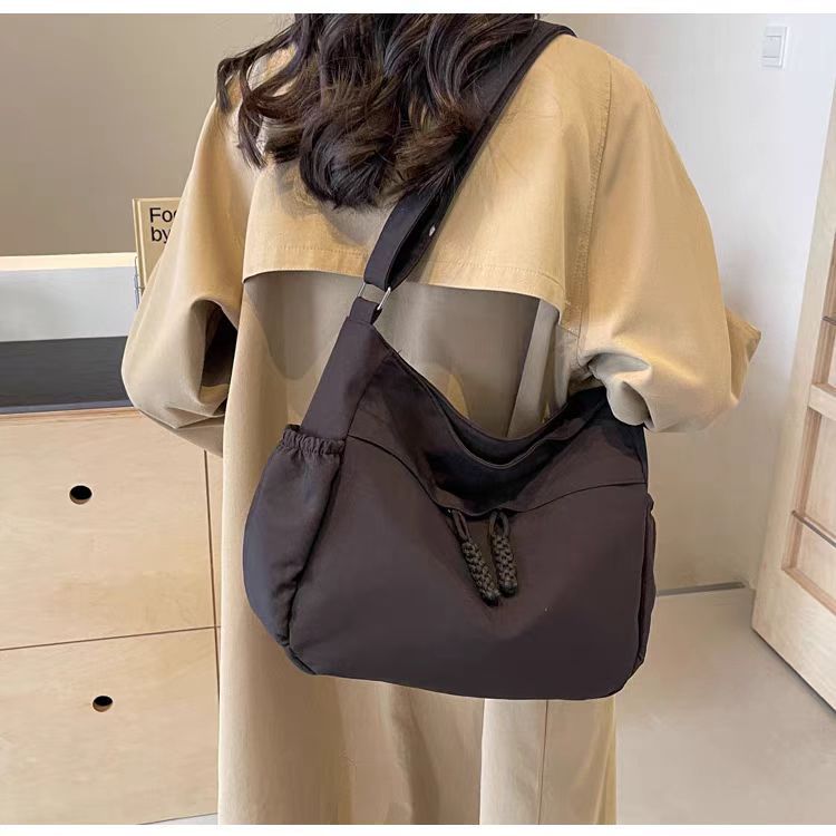 Adjustable Canvas Shoulder Bag with Multiple Pockets