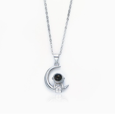 Astronaut's pendant featuring stars and the moon