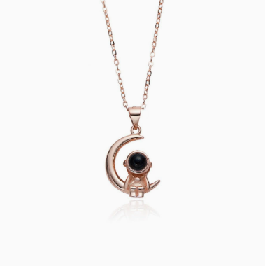 Astronaut's pendant featuring stars and the moon