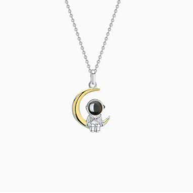 Astronaut's pendant featuring stars and the moon