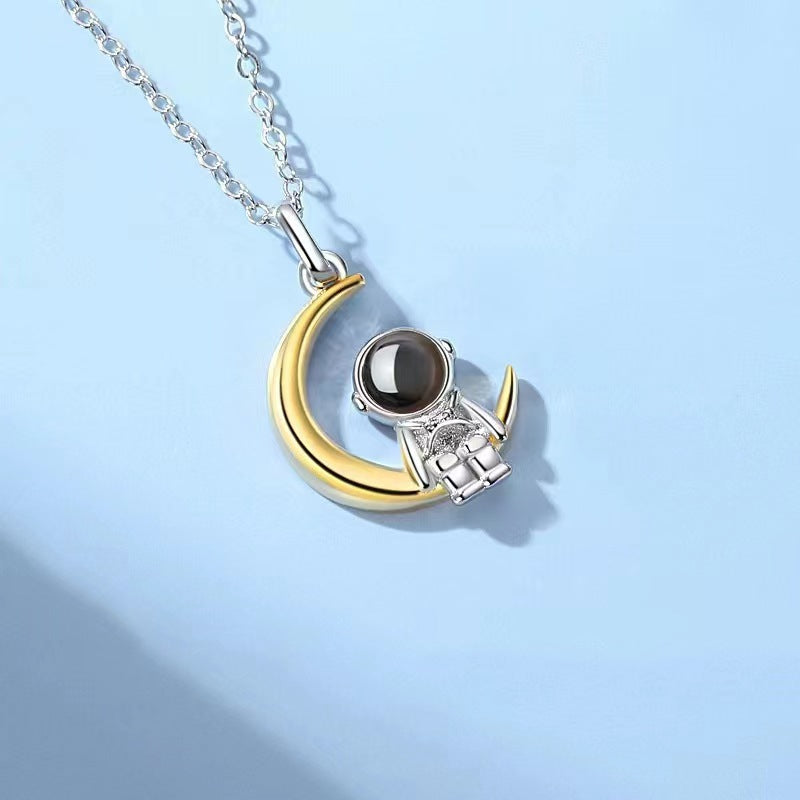 Astronaut's pendant featuring stars and the moon