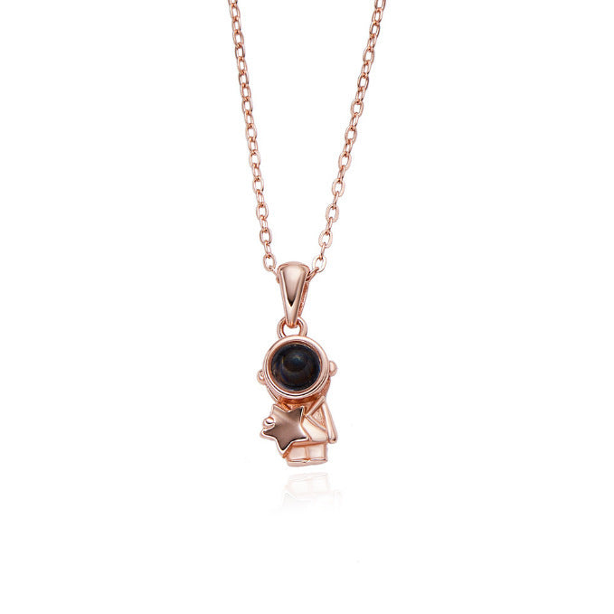 Astronaut's pendant featuring stars and the moon
