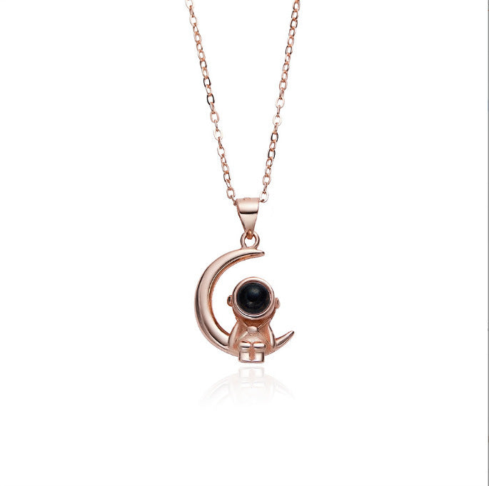Astronaut's pendant featuring stars and the moon