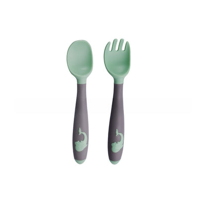 Baby learning to eat spoon and fork