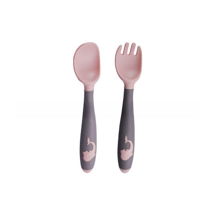 Baby learning to eat spoon and fork
