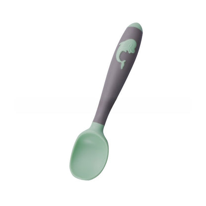 Baby learning to eat spoon and fork