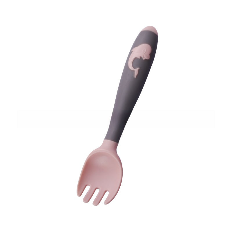 Baby learning to eat spoon and fork