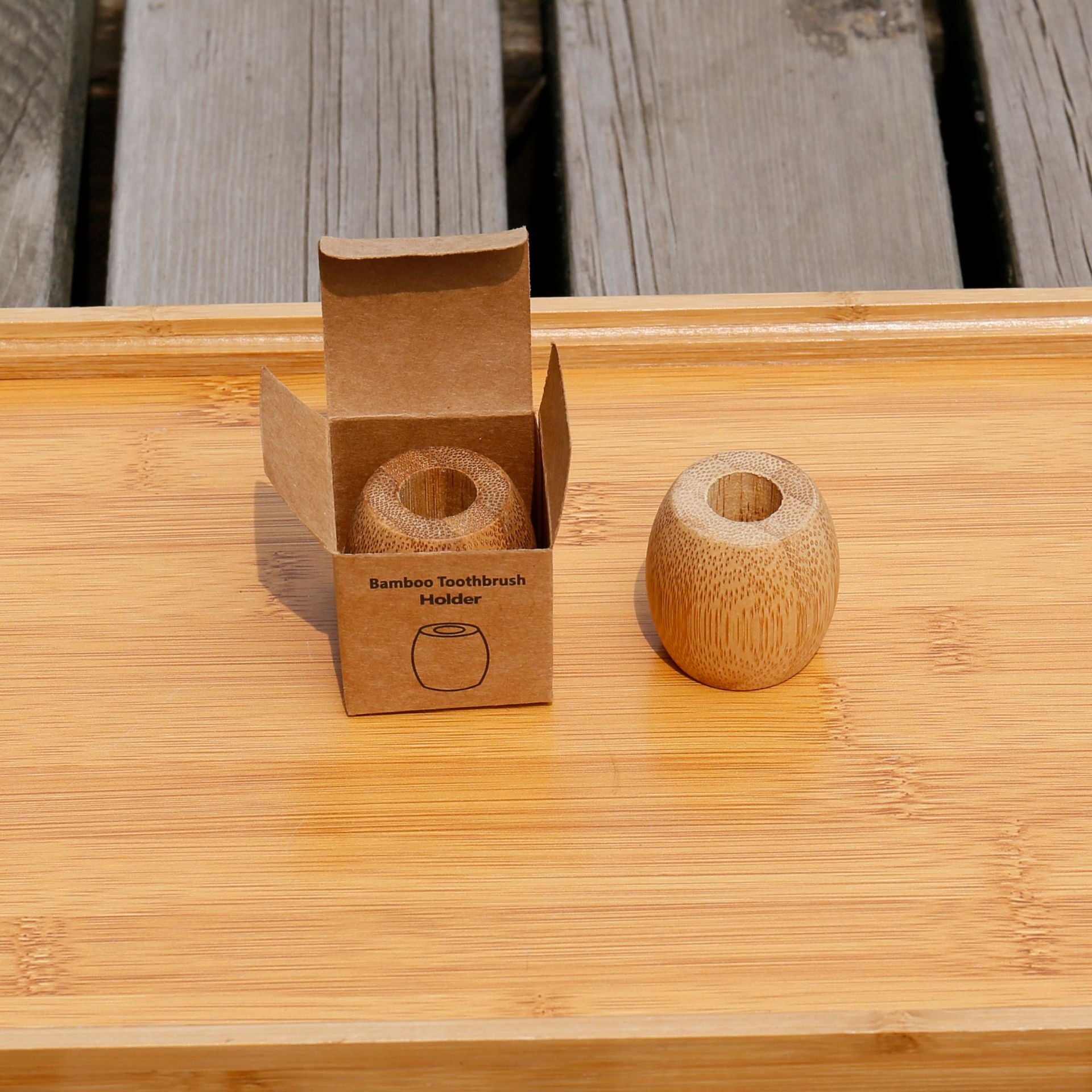 Bamboo toothbrush holder with a round base