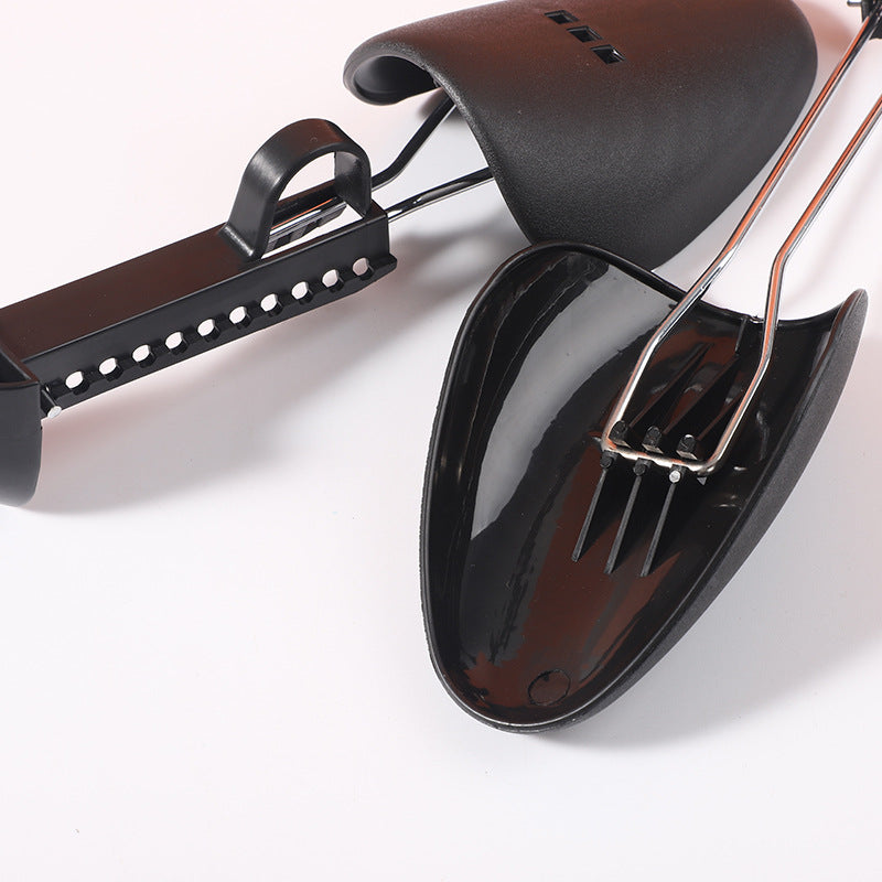 Black adjustable plastic shoe supports