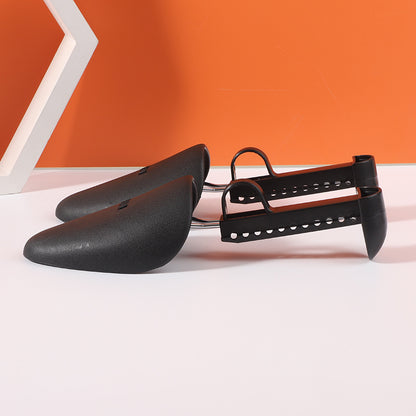 Black adjustable plastic shoe supports