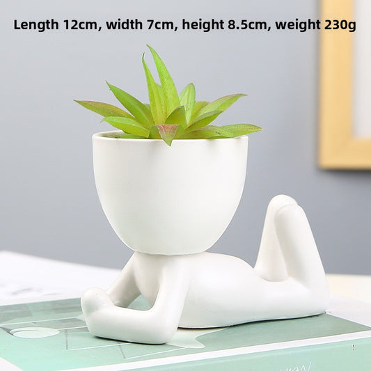 Black lazy person's small potted plant