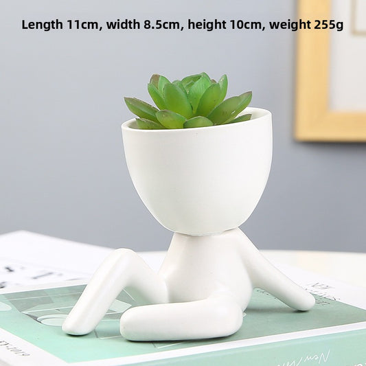 Black lazy person's small potted plant