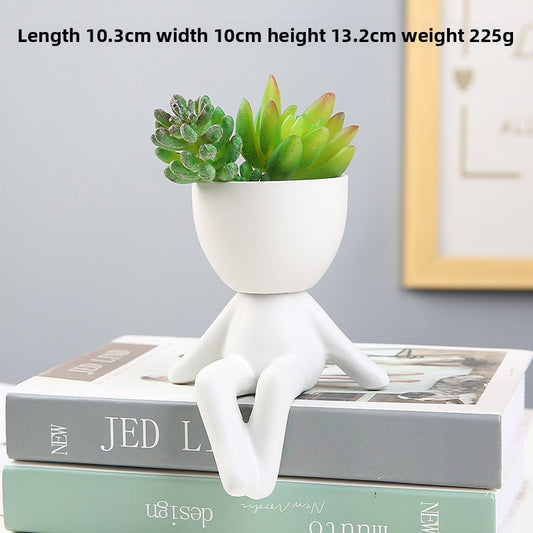 Black lazy person's small potted plant