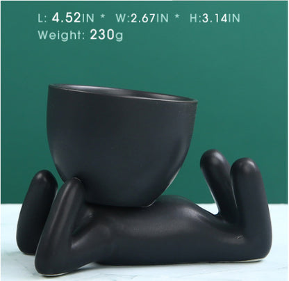 Black lazy person's small potted plant