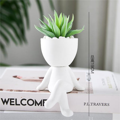 Black lazy person's small potted plant
