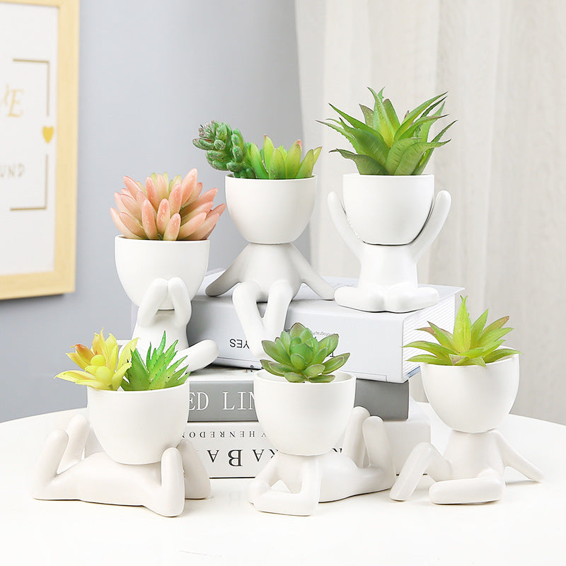 Black lazy person's small potted plant