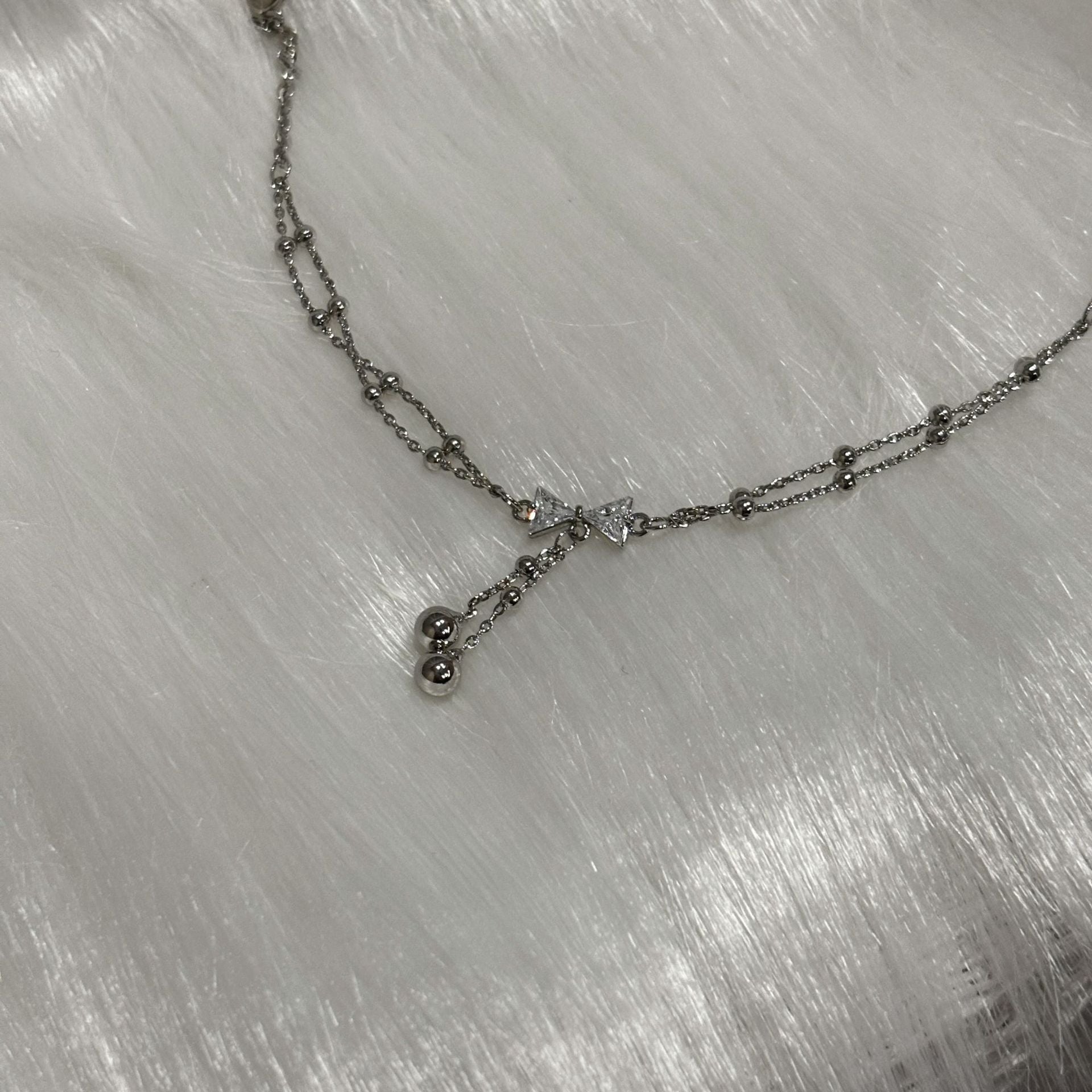 Bow Design Titanium Steel Bracelet with Geometric Pendant