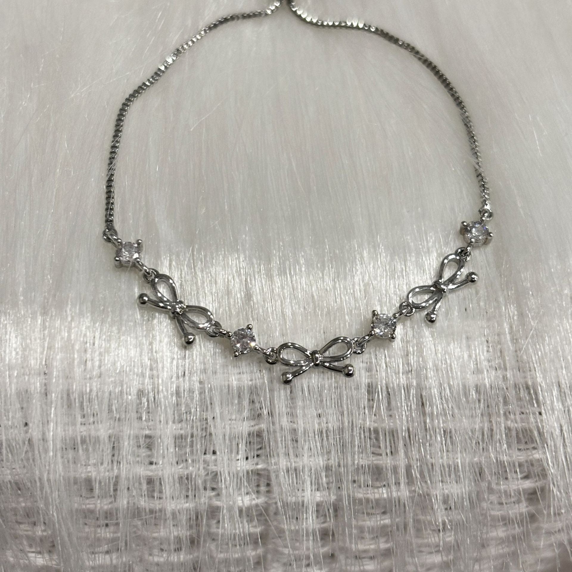 Bow Design Titanium Steel Bracelet with Geometric Pendant