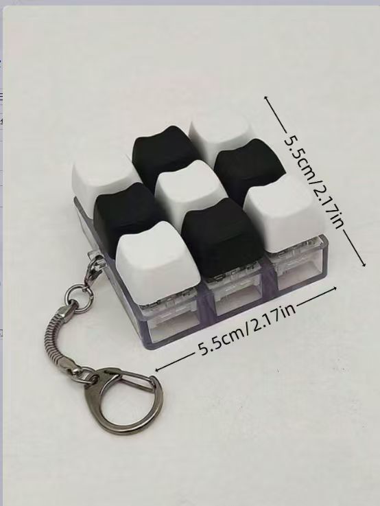 Button-operated stress-relieving toy keychain pendant
