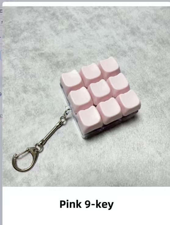 Button-operated stress-relieving toy keychain pendant