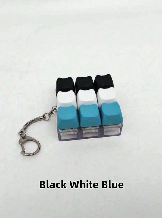 Button-operated stress-relieving toy keychain pendant