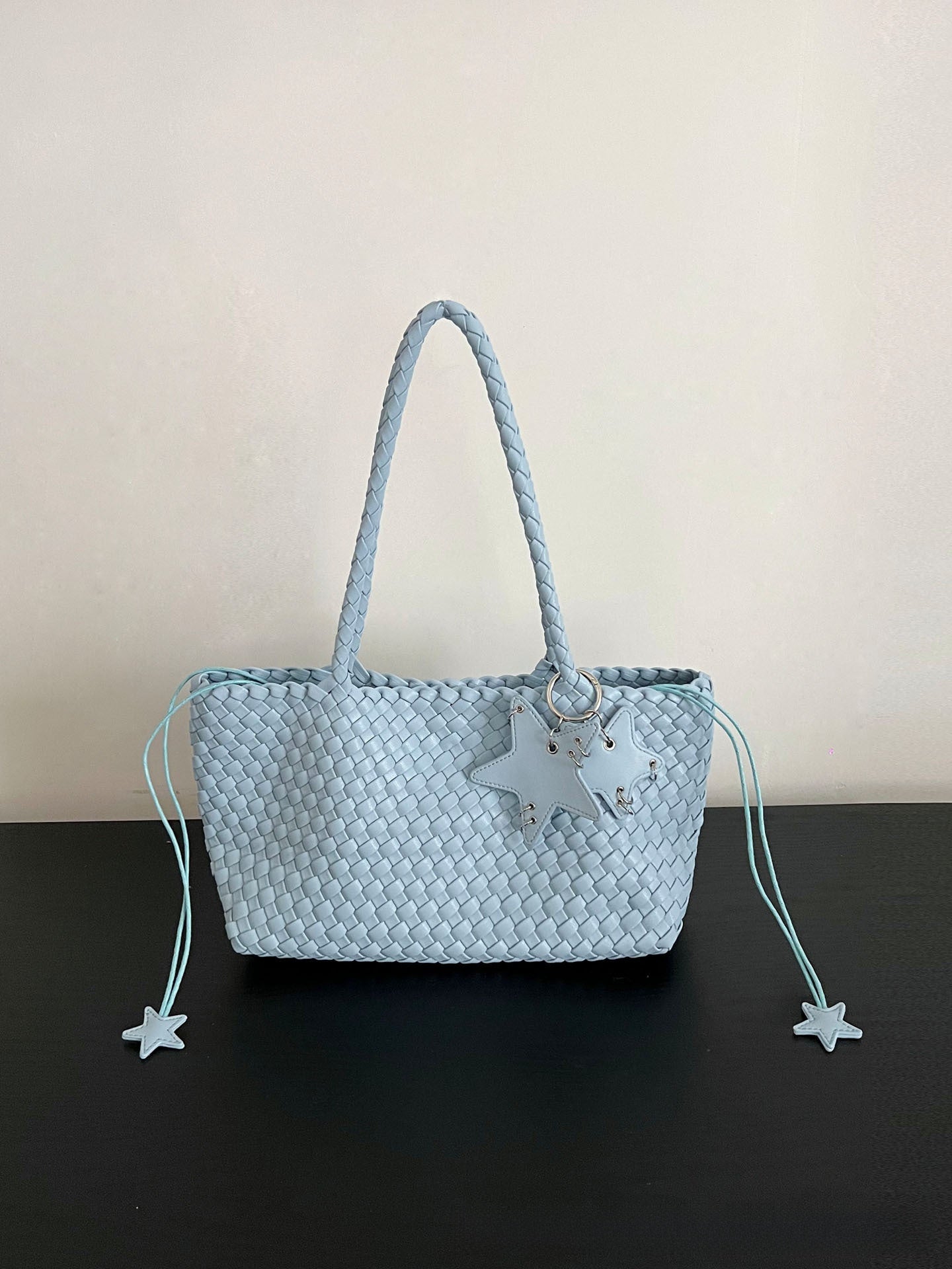 Champagne-colored woven tote bag