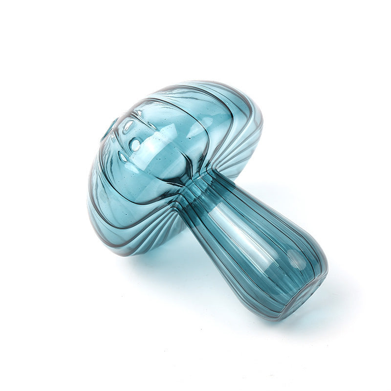 Creative glass ornaments, green plants, and flower vases