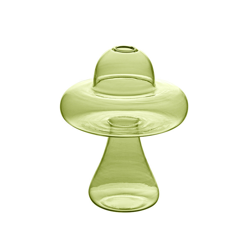 Creative glass ornaments, green plants, and flower vases
