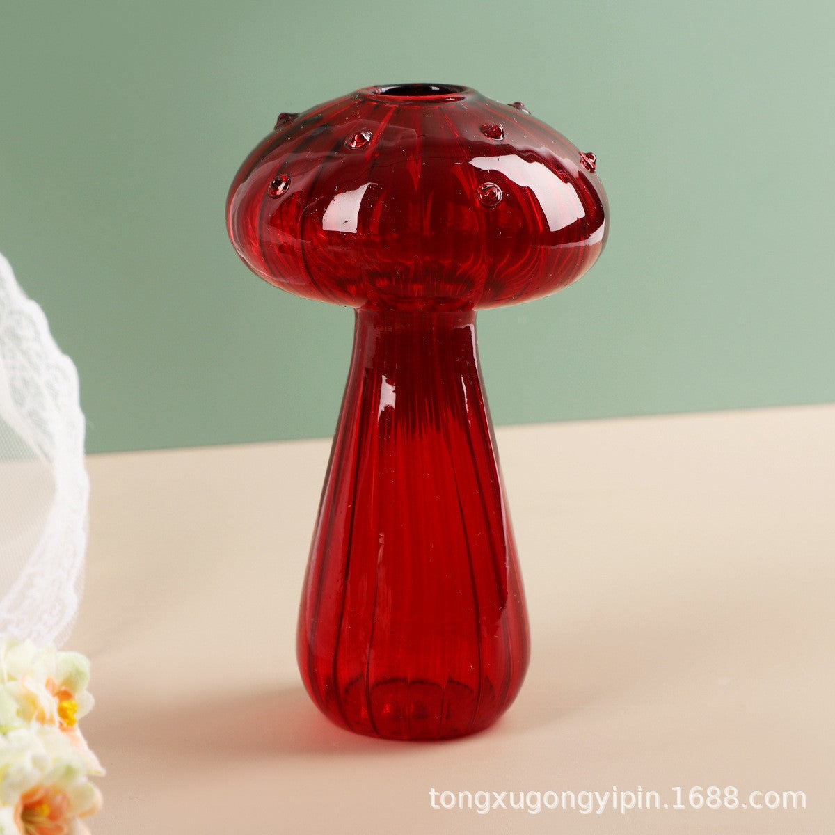 Creative glass ornaments, green plants, and flower vases