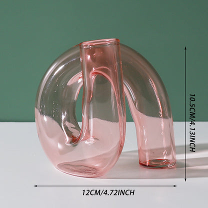 Creative glass ornaments, green plants, and flower vases