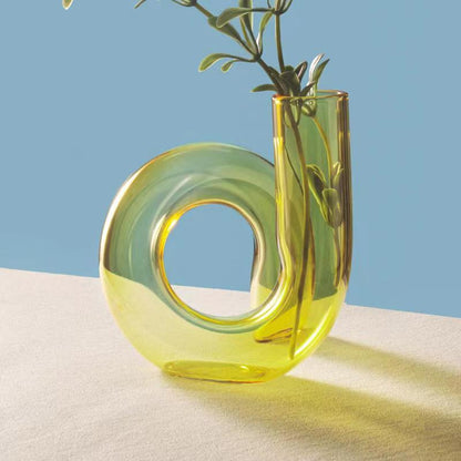 Creative glass ornaments, green plants, and flower vases