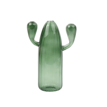 Creative glass ornaments, green plants, and flower vases