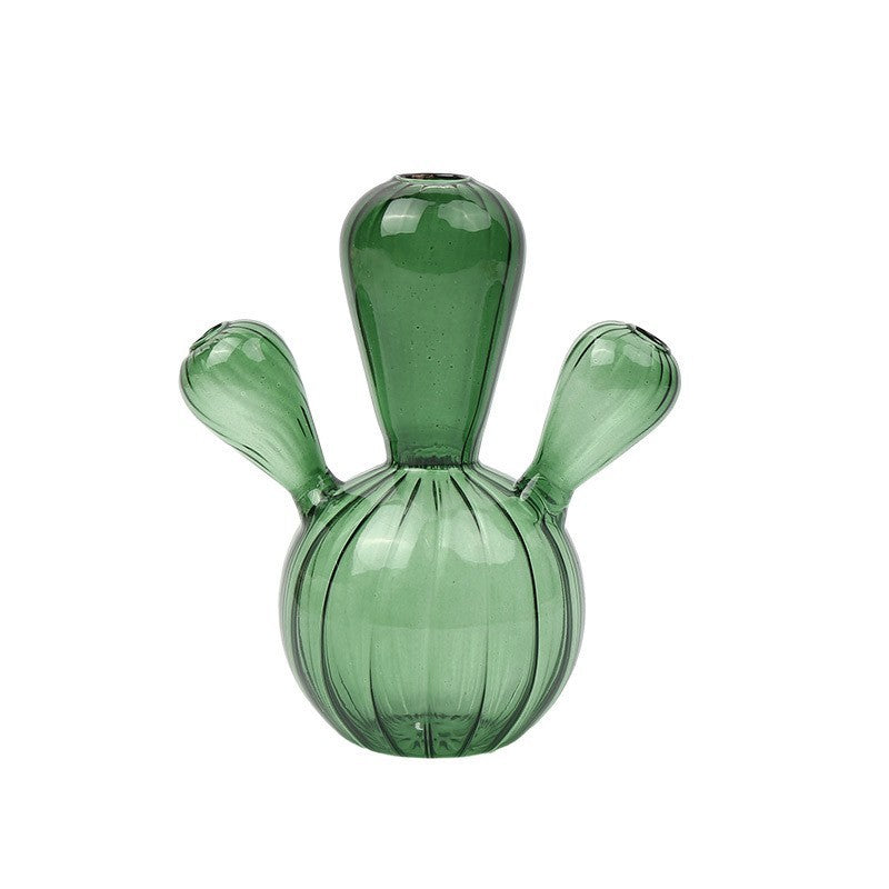 Creative glass ornaments, green plants, and flower vases