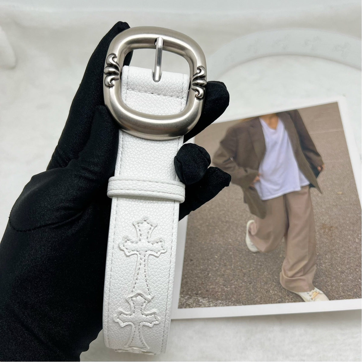 Cross with belt