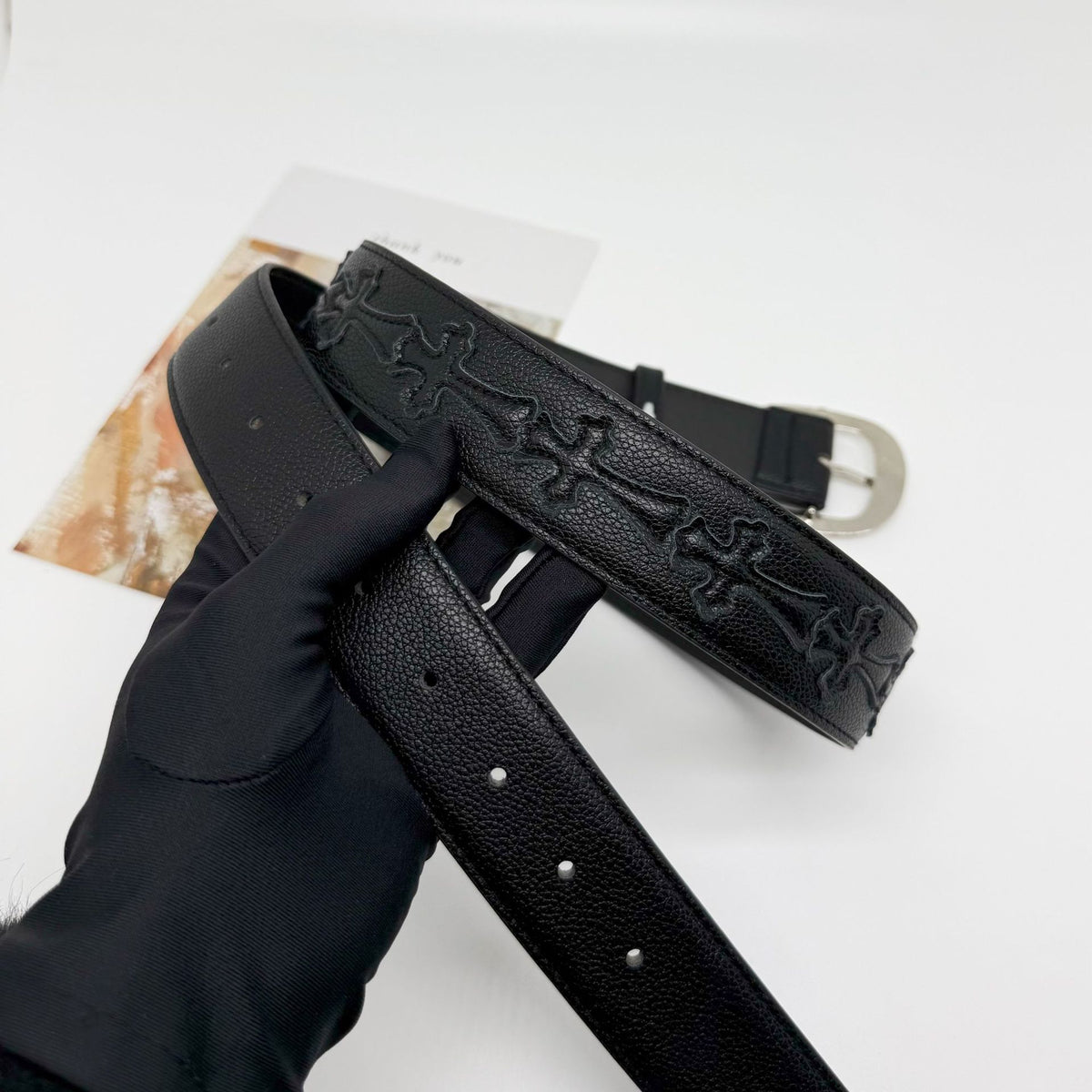 Cross with belt