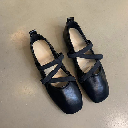 Crossed red Mary Jane ballet shoes