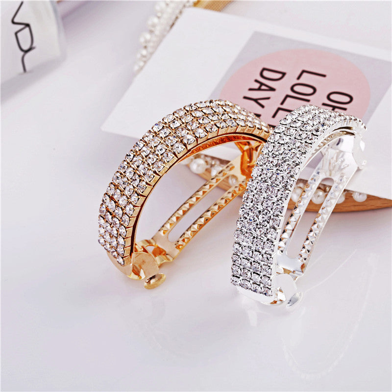 Diamond-encrusted hairpin at the back of the head for a stylish look