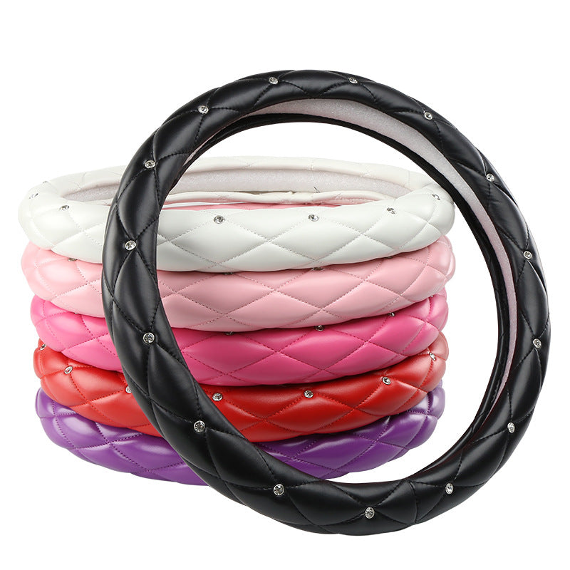 Diamond-encrusted steering wheel covers for automobiles
